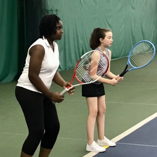 Girls playing tennis